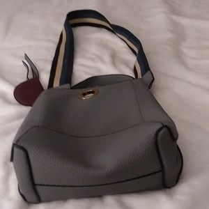 Handbag gray in color